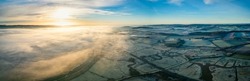 Sunrise Over Marshland And River Exe In Fog, RSPB Exminster And Powderham Marshe From A Drone, Exeter, Devon, England
