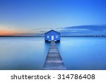 Sunrise over the Matilda Bay boathouse in the Swan River in Perth, Western Australia.
