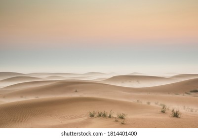sunrise over a misty desert near Dubai - Powered by Shutterstock