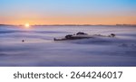 Sunrise over Mount Hobson in the fog. View from Mount Eden. Auckland. New Zealand. 