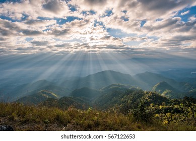 Sunrise Over The Mountain Landscape, A Beautiful Sun Rays With Clouds