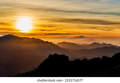 Sunrise over the mountains
 at Kelimutu volcano. Ende Regency, East Nusa Tenggara, Flores, Indonesia, Asia. Travel photo.