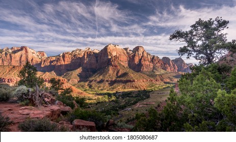 Sunrise over Mt. Kinesava and The West Temple in Zion National Park in Utah, USA, during an early morning hike on the Watchman Trail