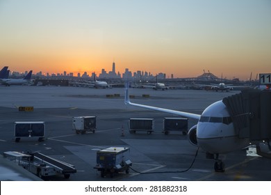 Sunrise Over New York City With Busy Airport In The Foreground.