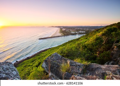 Sunrise over the ocean at Burleigh Heads National Park looking south towards Palm Beach on the Gold Coast in Queensland, Australia