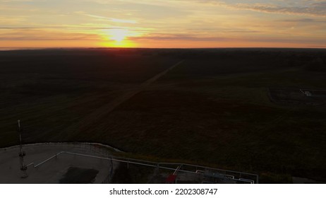 Sunrise Over An Oil And Gas Field. Drone View Of Oil Tanks And Pipelines. Oil And Gas Industry In The World During The Fuel Crisis. Oil And Gas Reserves In Russia Or Canada.