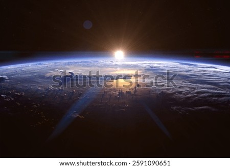 Sunrise over planet Earth, view from space. The Sun rises on the horizon. View from orbit to Earth. Elements of this image furnished by NASA.