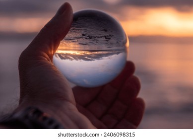 Sunrise Over Rangitoto Island Trough My Glass Ball. Taken from Takapuna Beach, Auckland, New Zealand. Orange hour. - Powered by Shutterstock