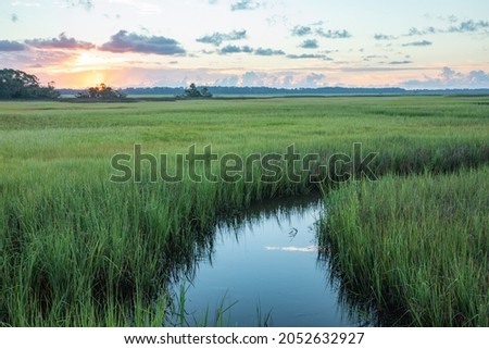Sunrise over the saltwater marsh along the Tolomato River in St. Augustine, Florida.