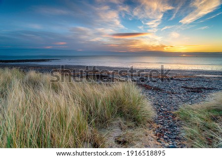 Sunrise over the sand dunes at New England Bay near Stranraer on the west coast of Scotland