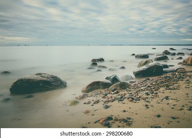 Sunrise over the sea. Beautiful long exposure landscape of rocky shore. vintage landscape - Powered by Shutterstock