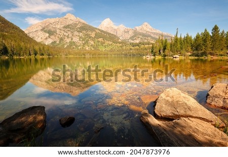 Sunrise over Taggart Lake at Grand Teton National Park, in the U. S. state of Wyoming. The natural lake is located at the terminus of Avalanche Canyon. 