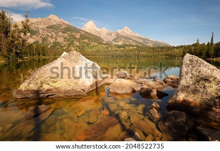 Sunrise over Taggart Lake at Grand Teton National Park, in the U. S. state of Wyoming. The natural lake is located at the terminus of Avalanche Canyon. 