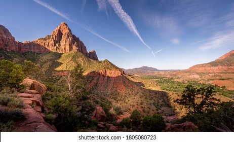 Sunrise over The Watchman Peak and the Virgin River Valley in Zion National Park in Utah, USA, during an early morning hike on the Watchman hiking trail