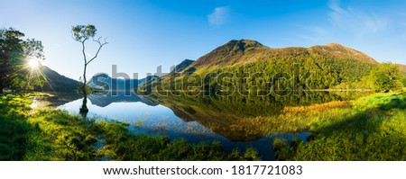 Sunrise panorama of Buttermere lake in the Lake District. England