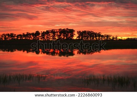 The sunrise reflect on the water in Meta, Colombia.