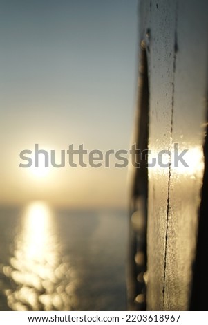 SUNRISE REFLECTION IN THE SEASHIP