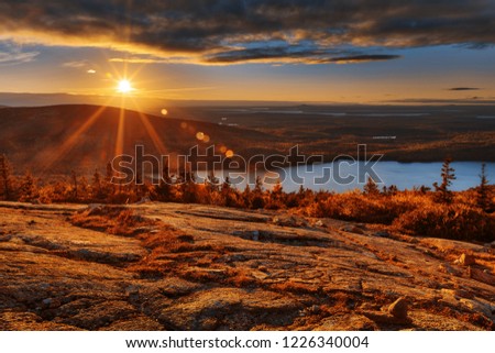 Sunrise scene from the Blue Hill Overlook of Cadillac Mountain in Acadia National Park, Maine (USA). HDR composite from multiple exposures.