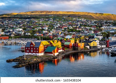 Sunrise scene of capital city Torshavn in Faroe Islands in North Atlantic. Urban scene of scandinavian city in warm golden sunlight.