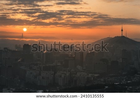 Sunrise scene of Seoul, city skyline, aerial view of N Seoul Tower at Namsan Park in the twilight sky in the morning, best vantage point and hiking from mountain in Seoul, South Korea