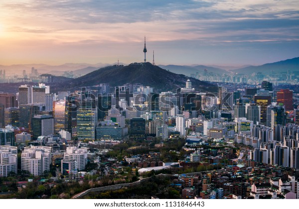 Sunrise scene of Seoul downtown city skyline,\
Aerial view of N Seoul Tower at Namsan Park in twilight sky in\
morning. The best viewpoint and trekking from inwangsan mountain in\
Seoul city, South Korea