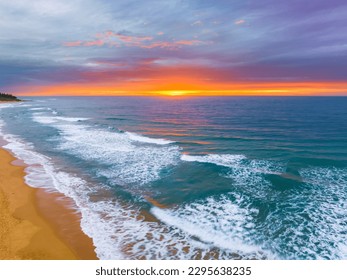 Sunrise seascape with cloud covered sky at Shelly Beach on the Central Coast, NSW, Australia. - Shutterstock ID 2295638235