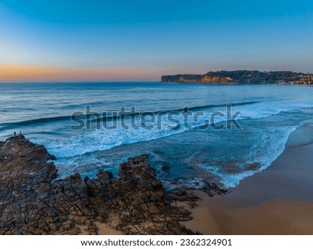 Sunrise seascape with tessellated rock platform at North Avoca on the Central Coast, NSW, Australia.