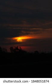 The Sunrise Seen Through Dark Clouds In West Des Moines, Iowa.