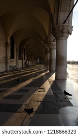 Sunrise shadows in gallery of Doges Palace, Venice