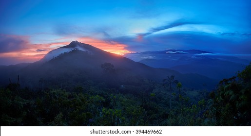 Sunrise In Sierra Nevada De Santa Marta, An Isolated Mountain Area Near To Caribbean Coast. Panoramic Photo With Highest Mountain Of Colombia, Pico Cristobal Colon Covered By Snow In Background.