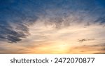 sunrise sky with gentle colorful clouds. Real amazing panoramic sunrise or sunset sky
