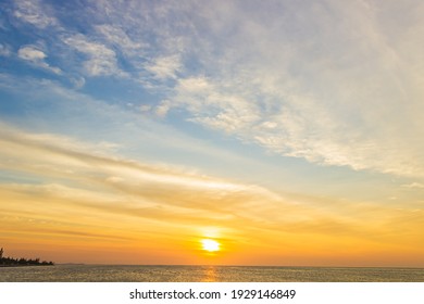 Sunrise sky over sea in Morning with Orange,Yellow and Pink sky, Dramatic twilight landscape with Sunset in evening, Goldren and romantic Sky banner of Sunset or sunlight for four seasons background