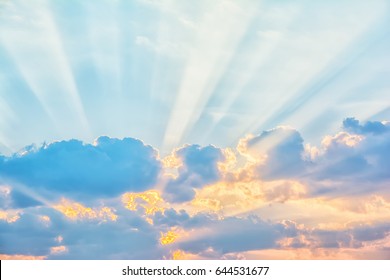 Sunrise Sky With Sun Golden Rays Breaking Through The Clouds