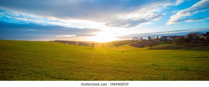 Sunrise In Spring Field At Early Morning