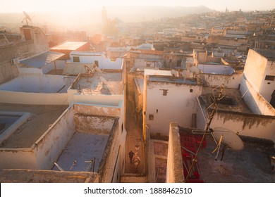 Sunrise or sunset cityscape rooftop view over the old town of Fez, Morocco, the country's second largest city renowned for its historic Fes el Bali walled medina.