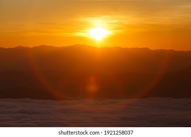 Sunrise or sunset over mountain hill forest with circle Lensflare.