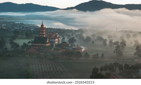The sunrise in the tea fields with the temple is extremely beautiful