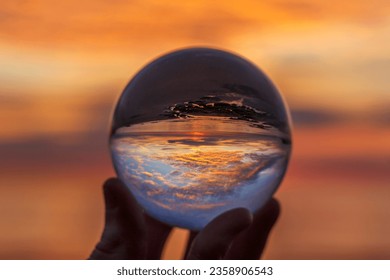 Sunrise through a glass orb.