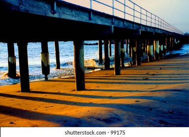 Sunrise under the boardwalk at the northern end of Atlantic City, New Jersey