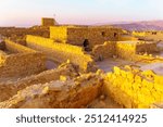 Sunrise view of the ancient ruins of the Masada Fortress, Dead Sea coast, Judaean Desert, southern Israel