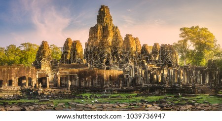 Sunrise view of ancient temple Bayon Angkor complex with stone faces of buddha Siem Reap on sunset, Cambodia