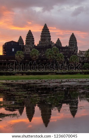 Sunrise view of ancient temple complex at entrance of Angkor Wat in Siem Reap, Cambodia the World Heritage (one of Seven Wonders of the Word)