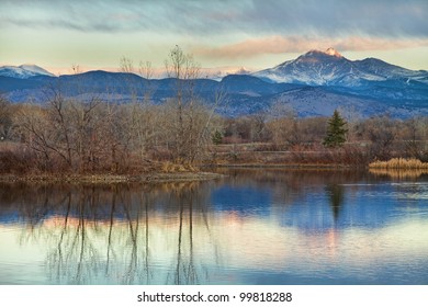 A sunrise view of Longs Peak at golden ponds in Longmont Colorado, Boulder County.