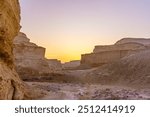 Sunrise view of the Masada Marls rocks formation (Havarey Masada), between Masada fortress and the Dead Sea, Judaean Desert, southern Israel