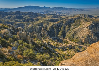 A Sunrise view of a mountain landscape featuring rugged, rocky terrain under a clear blue sky. Perfect for nature enthusiasts and adventurous explorers seeking captivating vistas and natural beauty. - Powered by Shutterstock