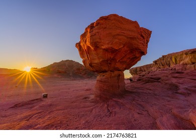 Sunrise view of the Mushroom rock formation (HaPitriya), in Timna desert park, southern Israel - Shutterstock ID 2174763821