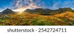 Sunrise view of Ogwen valley with Pen yr Ole Wen and Tryfan peaks in Snowdonia, North Wales. UK