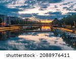 Sunrise view on Aura (Aurajoki) river with bridge and Turku Cathedral in the background in Turku, Finland.