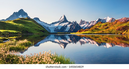 Sunrise view on Bernese range above Bachalpsee lake. Highest peaks Eiger, Jungfrau and Faulhorn in famous location. Switzerland alps, Grindelwald valley - Shutterstock ID 1450654829