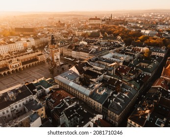 Sunrise view on Cracow main square and streets. Cracow, Lesser Poland province. St. Mary's Basilica, Rynek Glowny, Wawel castle